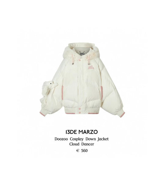 White cosplay down jacket with pink accents on a white background, featuring the brand '13DE MARZO'.