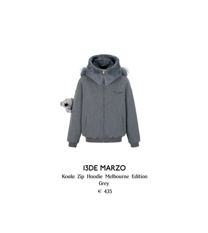 Grey zip hoodie with fur hood on a white background, featuring the brand '13DE MARZO'.